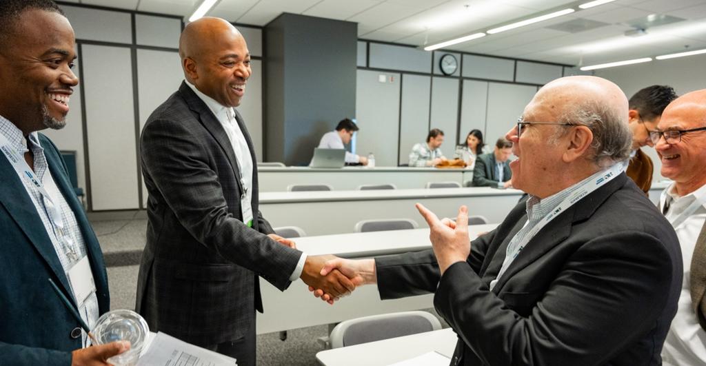 Advisory service members shake hands