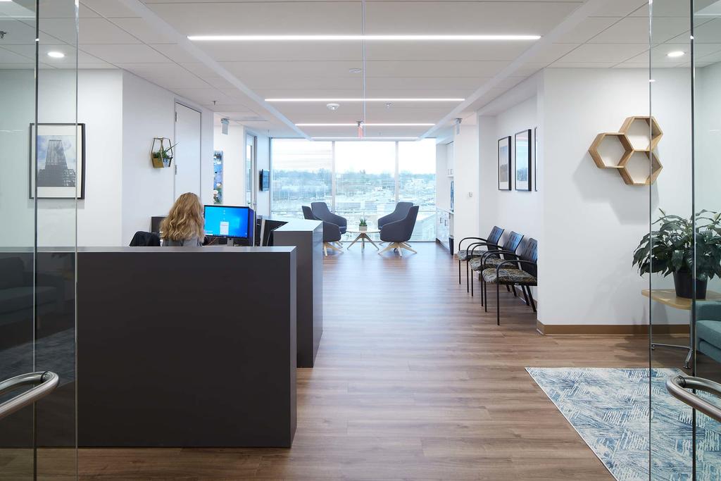 Entry to a Mason Enterprise Center. Visible are a receptionist, waiting area, and a small nook for conversation.