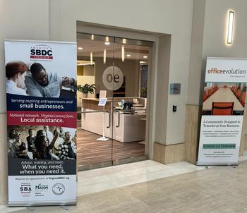 Entrance to the Herndon location, with signs for Office Evolution and the Virginia Small Business Development Center.